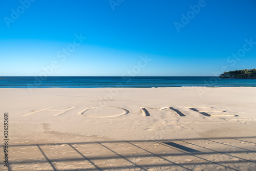 Home sign drawn into the  sand at the closed Bondi Beach,Closed Tamarama Beach, Sydney Australia photo