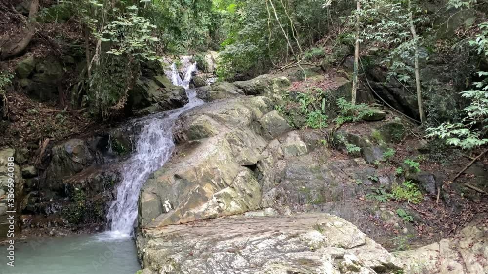 Waterfall among the green mountains. Waterfalls Of Asia. Landscapes Of Asia. Aerial photography. 