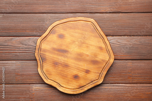 Cutting board on wooden background
