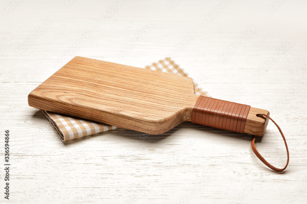 Fototapeta premium Cutting board on white wooden background
