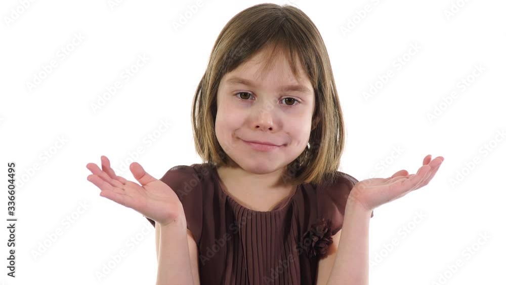 Shoulder shrug gesture. Shoulder shrug, we see that girl does not know or understand what you are talking about. Little girl demonstrating exposed palms, hunched shoulders, raised brow. Shoulder shrug gesture. Shoulder shrug, we see that girl does not know or understand what you are talking about. Little girl demonstrating exposed palms, hunched shoulders, raised brow.