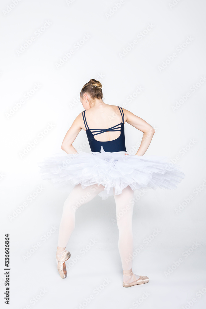 Naklejka premium Young ballerina practising ballet moves