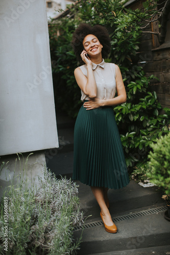 Young woman with a mobile p...