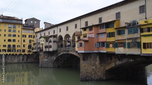 view of the old colorful bridge ponte vecchio Florence in italy during winter season