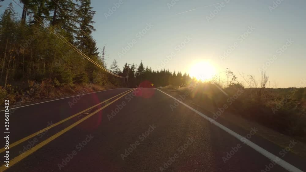 Driving On Empty Rural Road At Sunset In Autumn, Beautiful Light, Oregon, USA Driving On Empty Rural Road At Sunset In Autumn, Beautiful Light, Oregon, USA