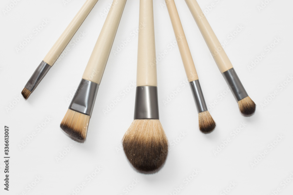 Collection of brown makeup brushes Collection of brown makeup brushes