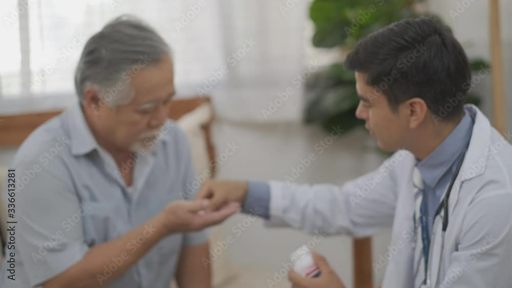 Soft blur scene of doctor give medicine and explain to old man for treatment of disease at home. Soft blur scene of doctor give medicine and explain to old man for treatment of disease at home.