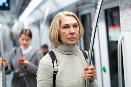 Mature woman in subway car © JackF