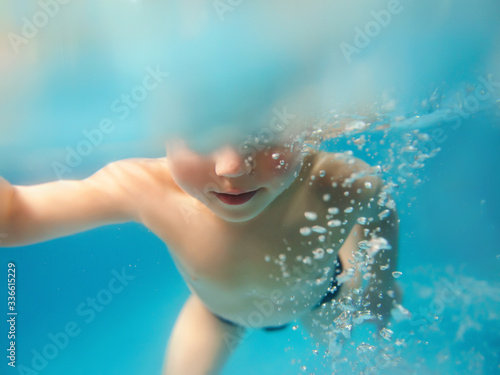 Young caucasian boy underwater in the swimming pool © k8most