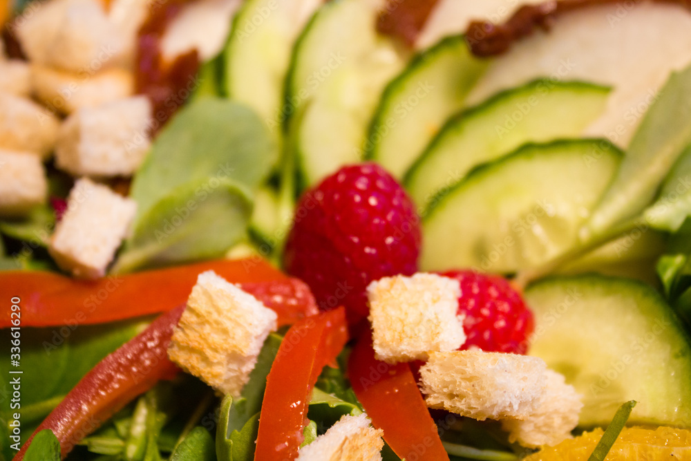 Fresh lettuce salad with raspberry and croutons. close up. Fresh lettuce salad with raspberry and croutons. close up.