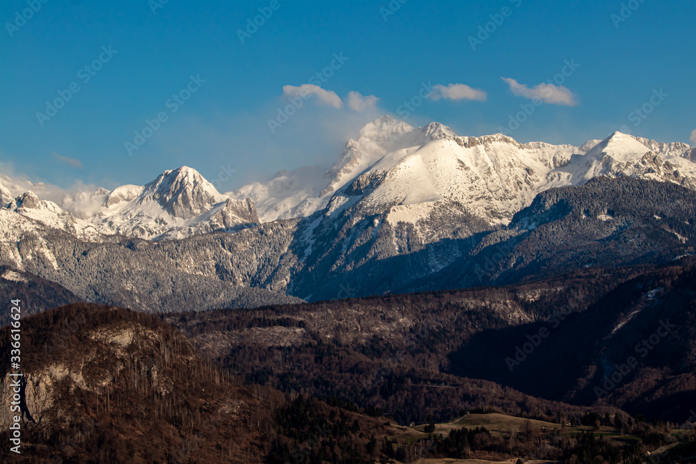 Mount Triglav covered in mist with Bohinj valley