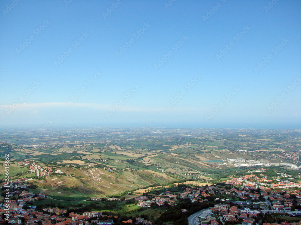 Panoramic top view of the endless Adriatic that merges with clear blue skies on the horizon on a sunny summer day.