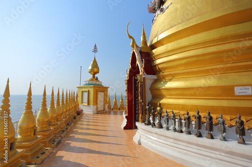 Gold pagoda and church located in the sea at Hong Thong Temple, Chachoengsao, Thailand