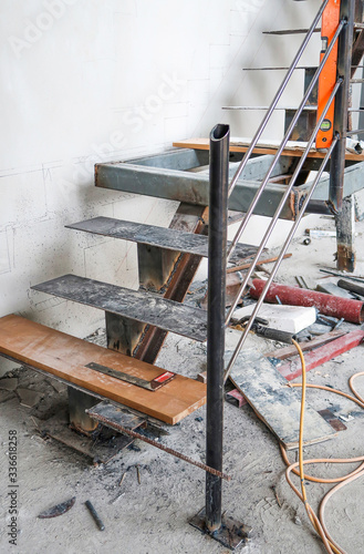 Wood on metal stairs under construction