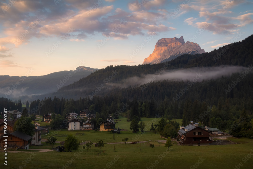 First morning light over San Vito di Cadore village, Dolomites, Italy
