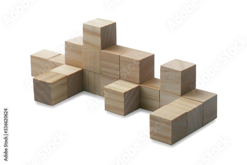 Selective focus of toy wooden cube isolated on a white background.