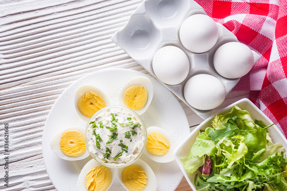 boiled chicken eggs on a white wooden rustic background boiled chicken eggs on a white wooden rustic background