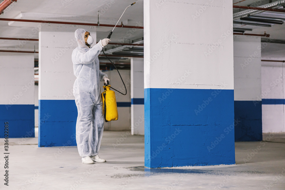 Sanitizing interior surfaces, garage. Cleaning and Disinfection inside buildings, the coronavirus epidemic. Professional teams for disinfection efforts. Infection prevention and control of epidemic. 