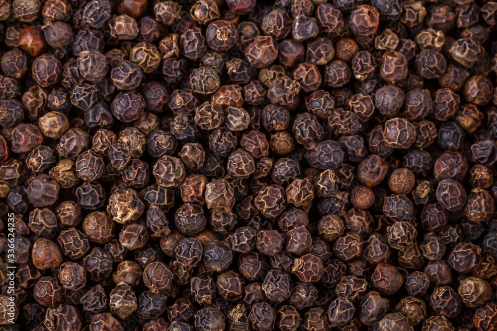 fragrant black pepper on white acrylic background fragrant black pepper on white acrylic background