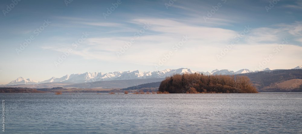 Orava island with beautiful Rohace snowy hills on the background, Slovakia