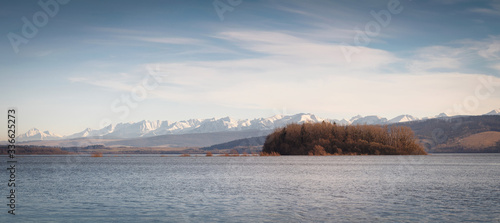 Orava island with beautiful Rohace snowy hills on the background, Slovakia photo