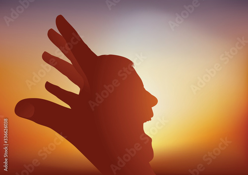Concept de la psychanalyse, avec un visage qui apparait au travers d’une main pour exprimer les contradictions mentales d’un individu.