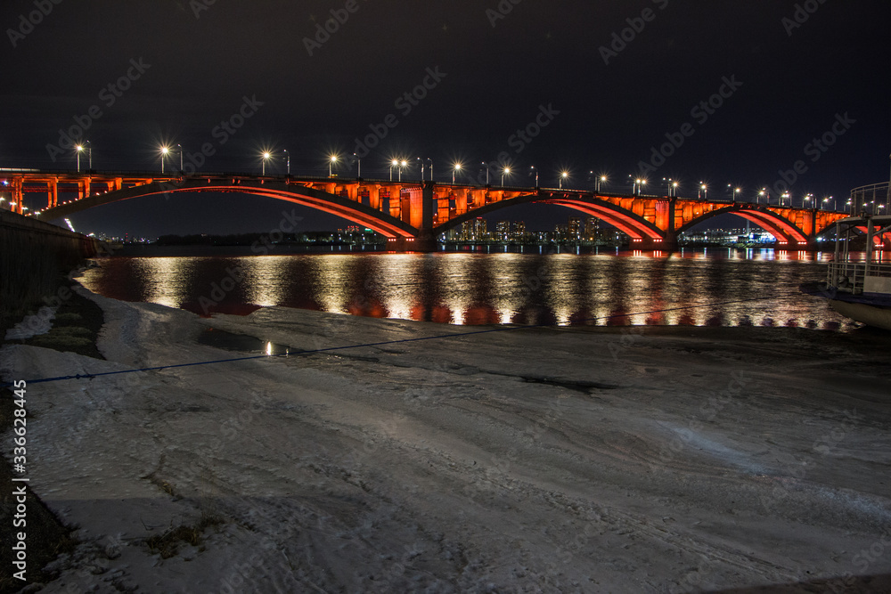 large bridge with bright illumination at night in Krasnoyarsk Siberia, Russia