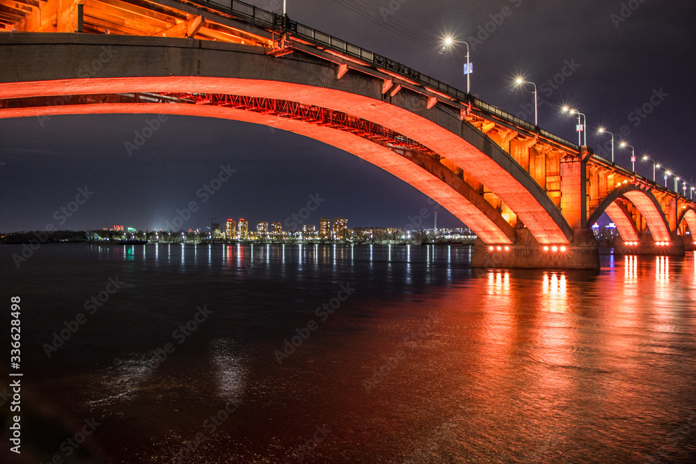 Fototapeta premium large bridge with bright illumination at night in Krasnoyarsk Siberia, Russia