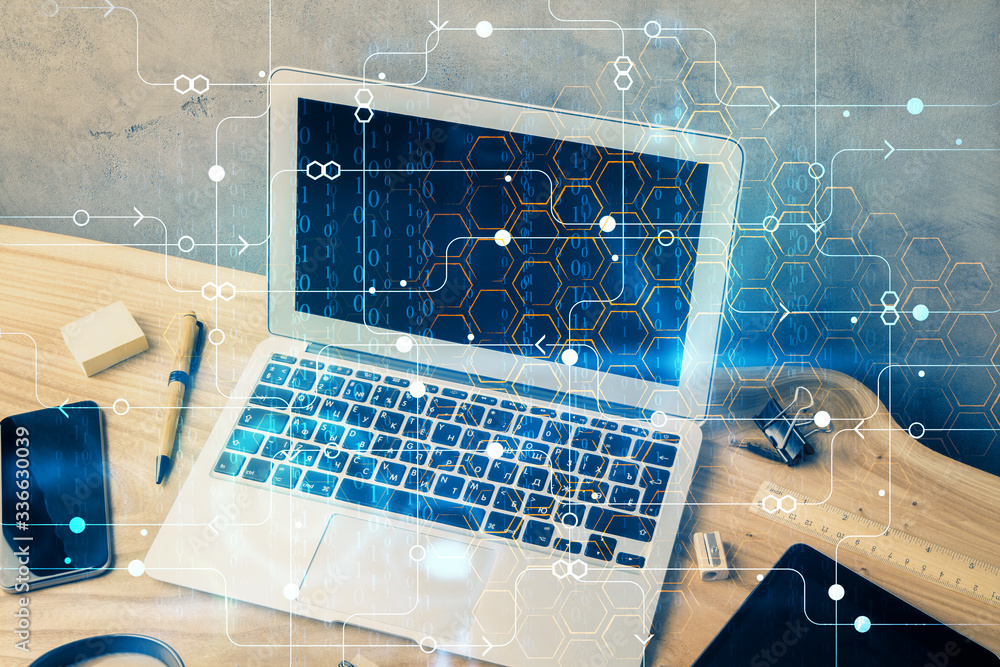 Double exposure of desktop computer and technology theme hologram. Concept of software development. Double exposure of desktop computer and technology theme hologram. Concept of software development.