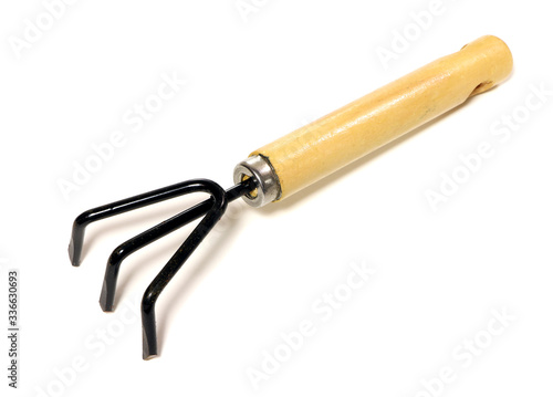 Gardening tools . Gardening rake isolated on a white background. Gardening trowel.