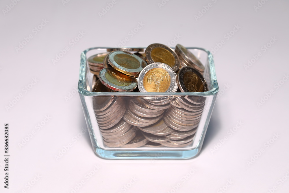 Ten baht baht, Thailand, in the glass cup View from the side Ten baht baht, Thailand, in the glass cup View from the side