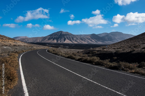 Volcanic landscape with road in Canary Island, Lanzarote.
