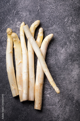 Fresh, white asparagus against a dark background. Healthy eating concept.