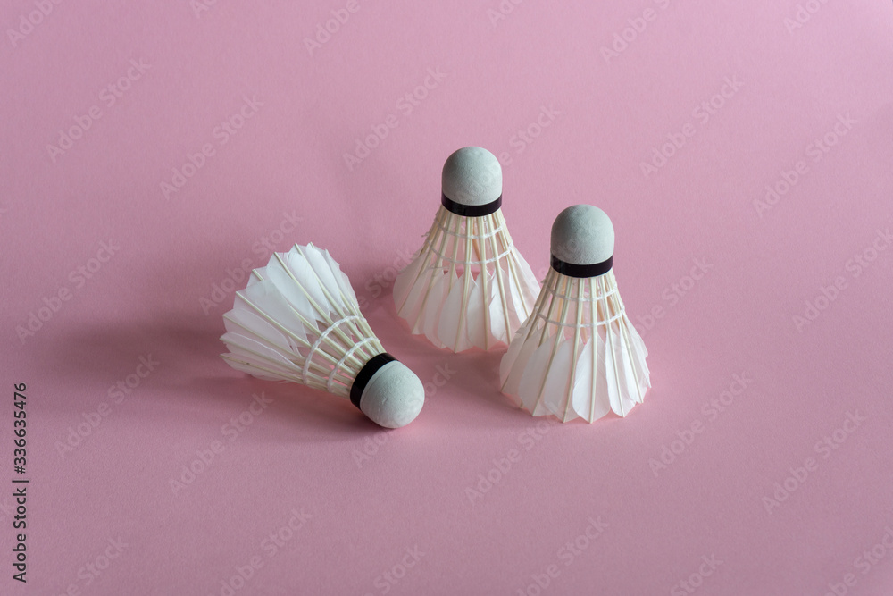 Shuttlecocks on pink background