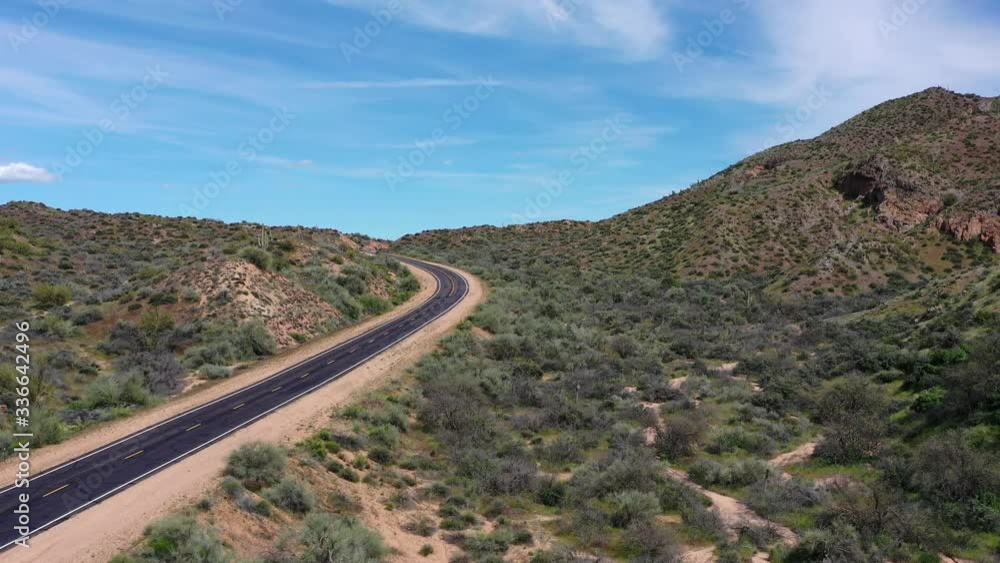 Push in on a lonely desert highway snakes through the rugged Sonoran Desert in the Tonto National Forrest, Scottsdale, Arizona. Push in on a lonely desert highway snakes through the rugged Sonoran Desert in the Tonto National Forrest, Scottsdale, Arizona.