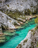 Rocky banks of emerald Soca river in autumn season in Slovenia
