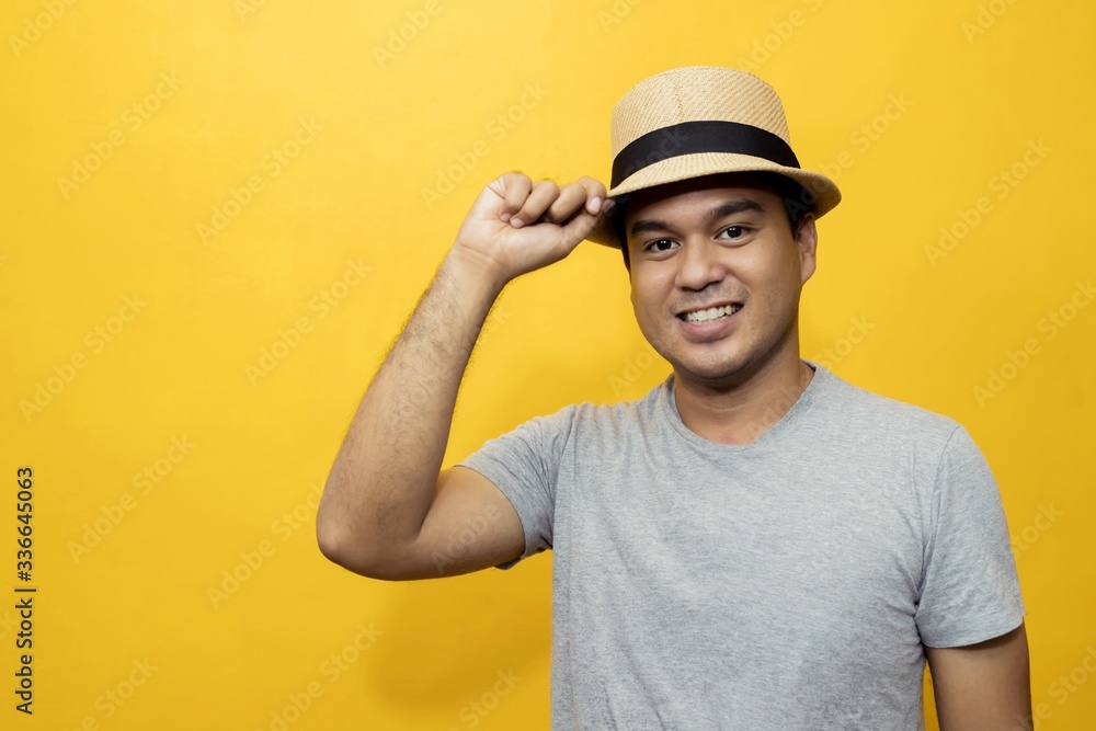Handsome men in a good mood, bright yellow background room
