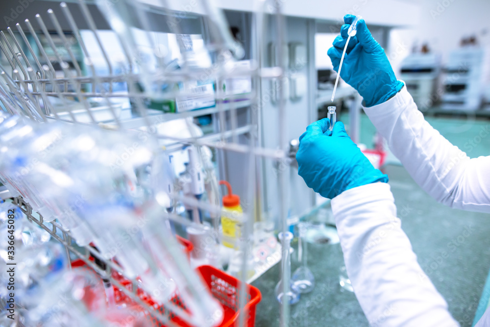 Laboratory scientist conducting a research, experiments, chemist adjusts samples in a petri dish, chemistry concept Laboratory scientist conducting a research, experiments, chemist adjusts samples in a petri dish, chemistry concept