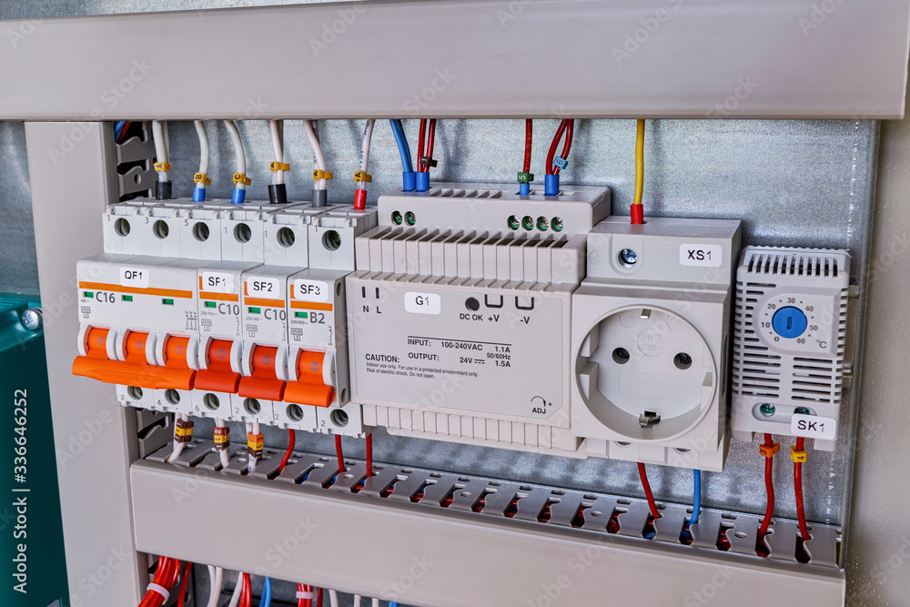 Circuit breakers, thermostat, power supply, socket in electrical Cabinet. The wires are connected to electrical equipment. Professional production, repair and maintenance. Circuit breakers, thermostat, power supply, socket in electrical Cabinet. The wires are connected to electrical equipment. Professional production, repair and maintenance.