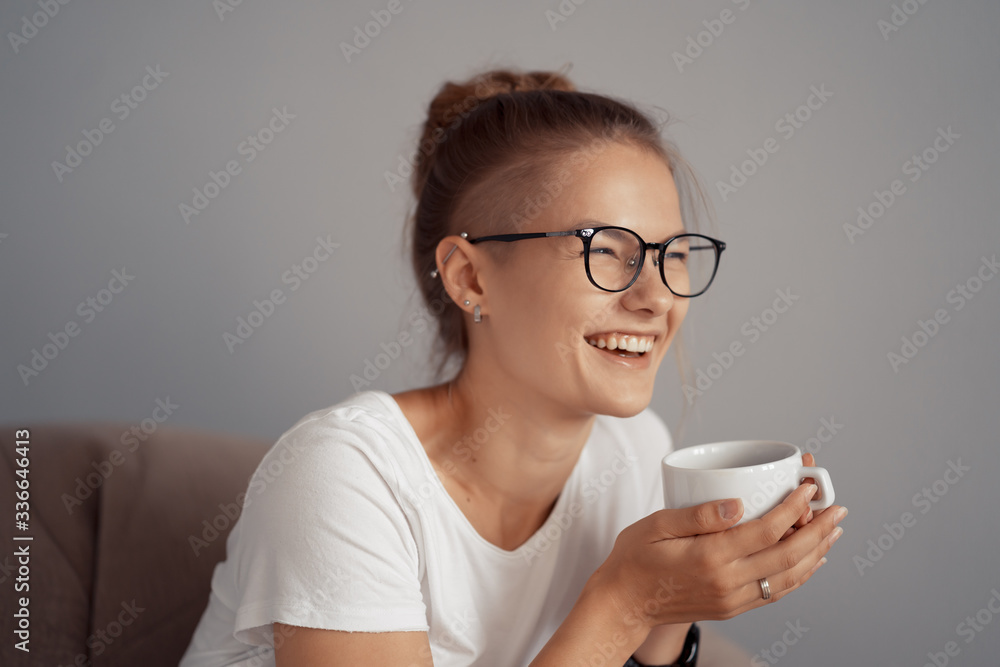 Cute girl is drinking coffee at home Cute girl is drinking coffee at home