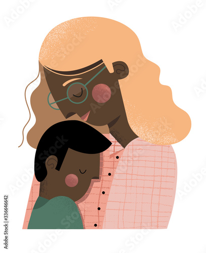 A mother and son embracing.