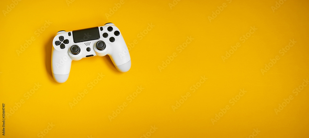 Videgame competition. Gaming concept. White joystick on yellow background.