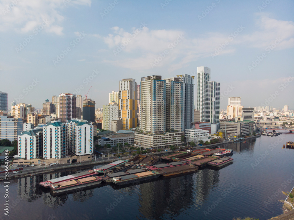 Aerial shot of construction sites, condominiums, office blocks and high rises located near the Pasig river in Metro Manila, Philippines