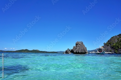 High, rocky stones and turquoise lagoon in Philippines