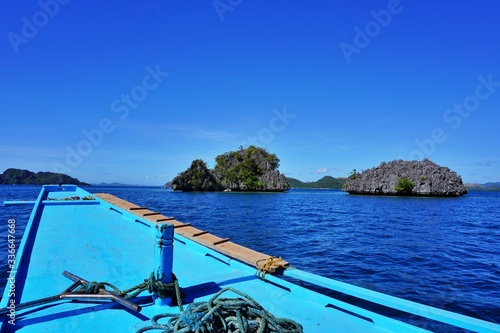 Wallpaper Mural Typical filipino boat parked at the sandy beach in clear turquoise sea water - it is real paradise scenery Torontodigital.ca