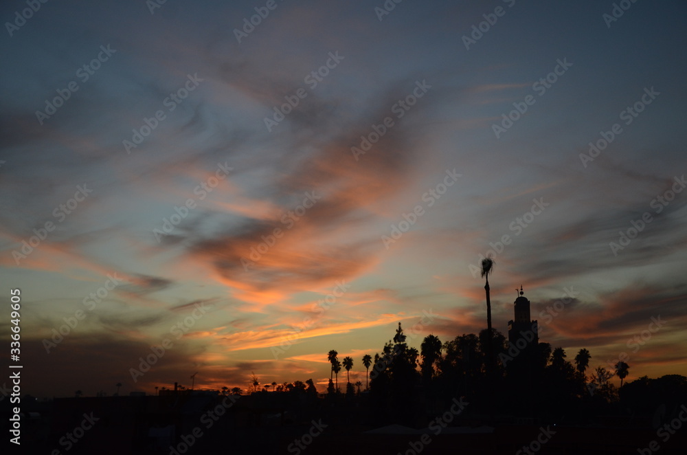Beautiful sunset time at Marrakech with gradient colour of sky. Marrakesh, a former imperial city in western Morocco, is a major economic center and home to mosques, palaces and gardens.