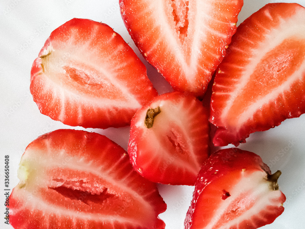 garden berries on a white background. perfect background for slides. an advertising option for farmers. the farm's products. red strawberries. strawberries in sugar