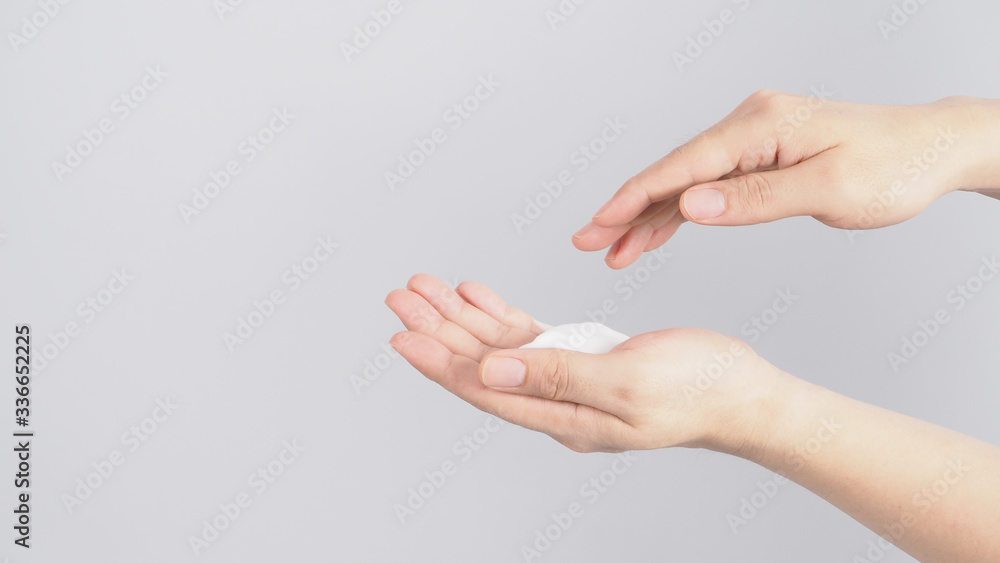 Hands washing gesture with foaming hand soap on white background. Hands washing gesture with foaming hand soap on white background.