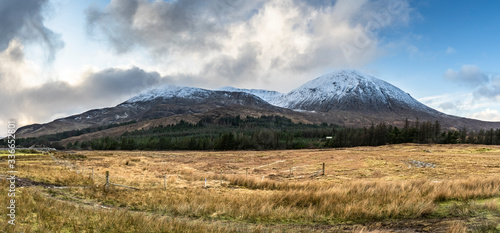 Pasture in a high snowy mountains