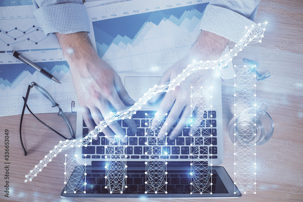 Double exposure of market chart with man working on computer on background. Concept of financial analysis. Double exposure of market chart with man working on computer on background. Concept of financial analysis.